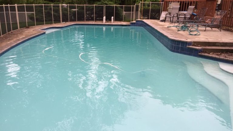 Cloudy milky pool water after a summer rain storm in Atlanta GA