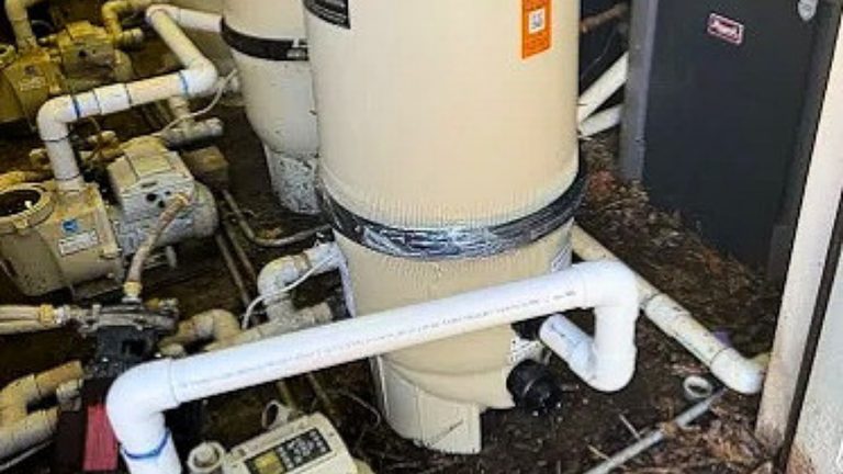 Pool equipment pad with pump, cartridge filter, and heater at a Metro Atlanta home