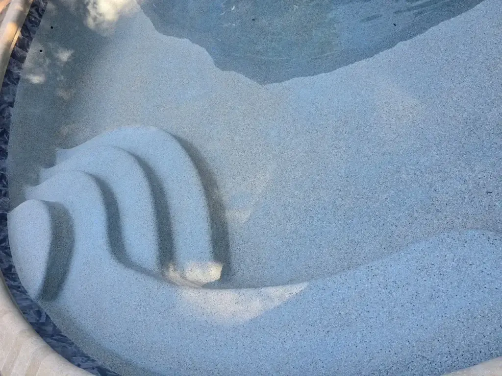 Close-up of new interior finish on renovated pool steps