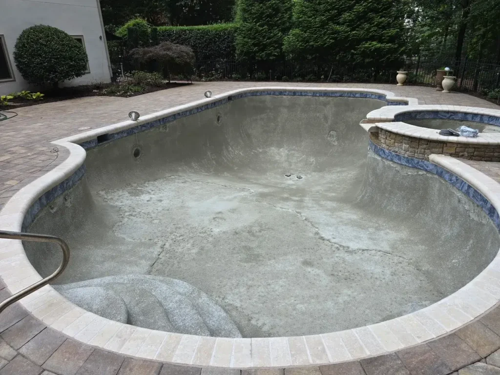 Pool shell prepared for a new interior finish, with new waterline tile installed