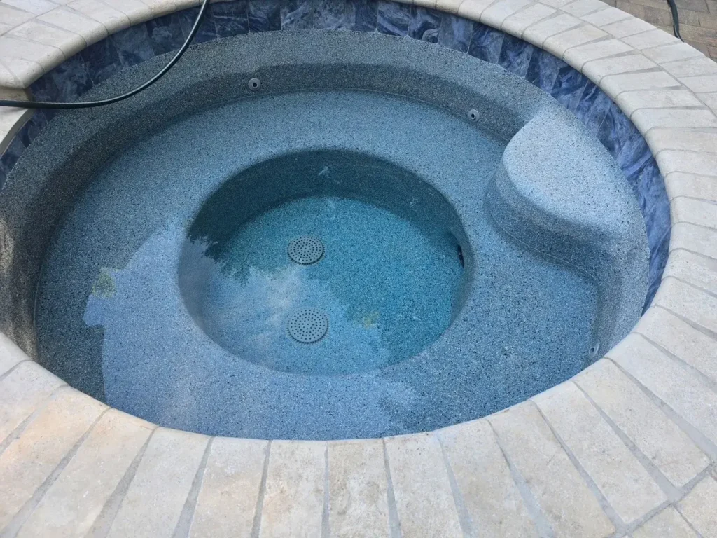 Renovated spa with new waterline tile and interior finish