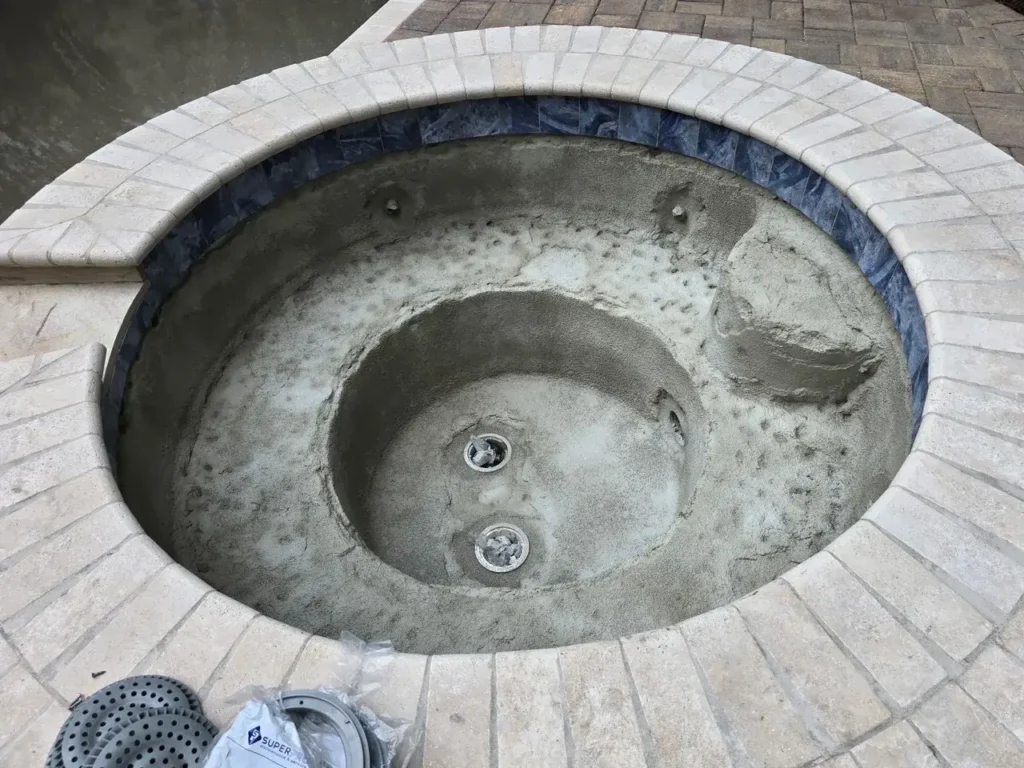 Attached spa drained and prepared for resurfacing